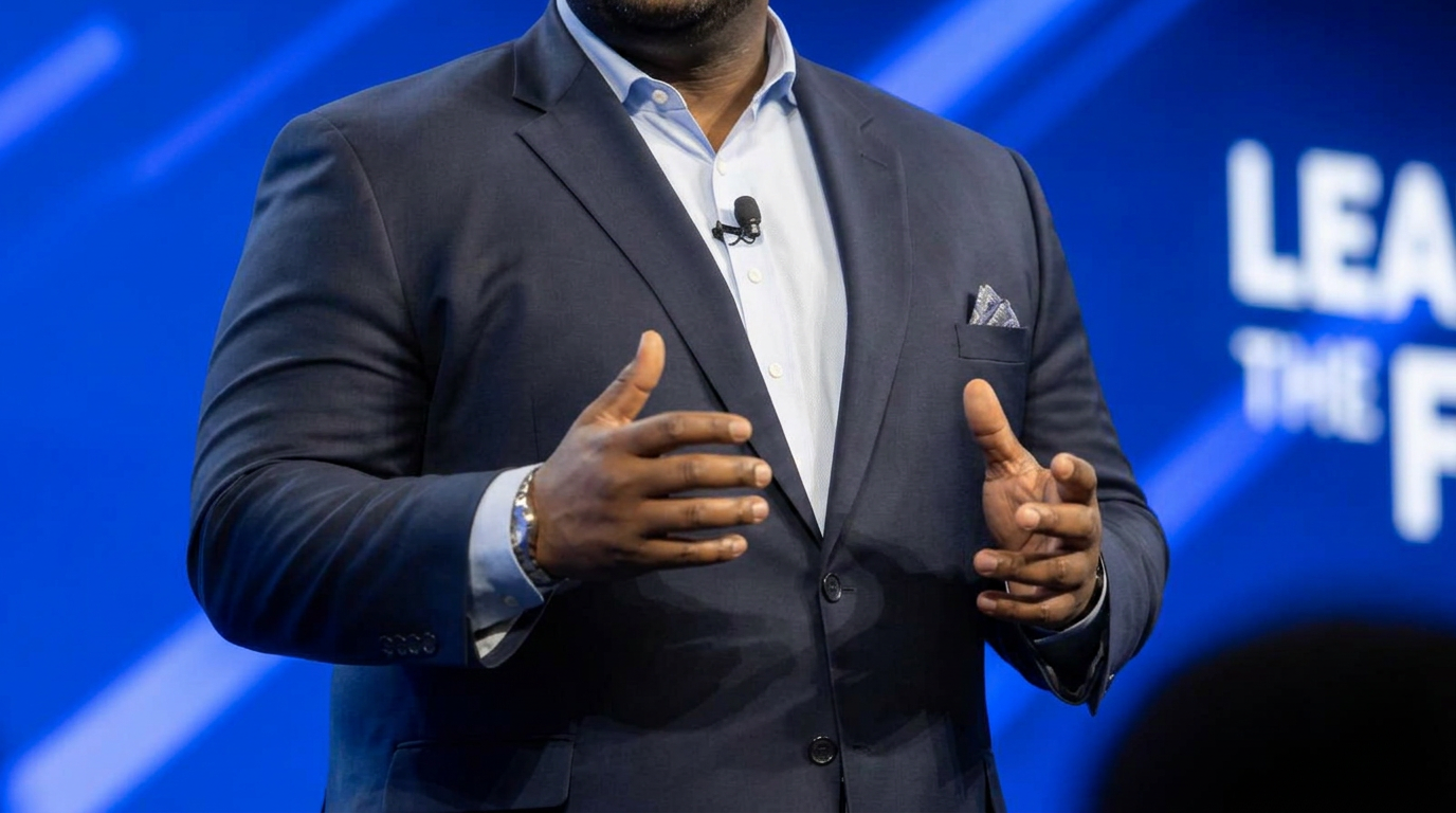 Illustrative image of a keynote speaker on stage, shown from the shoulders down